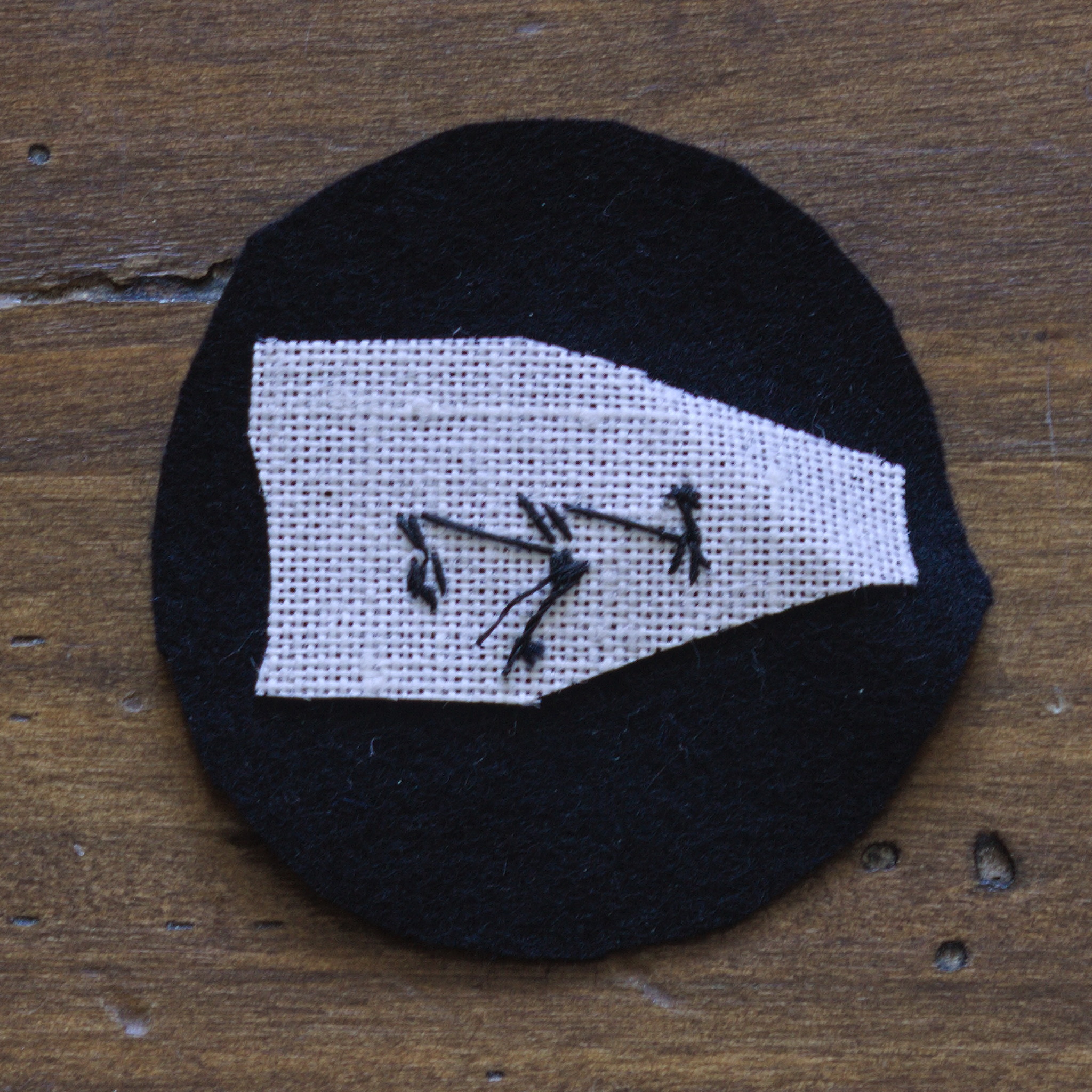 ../../../_images/0203-back_of_sewn_pin.jpg
